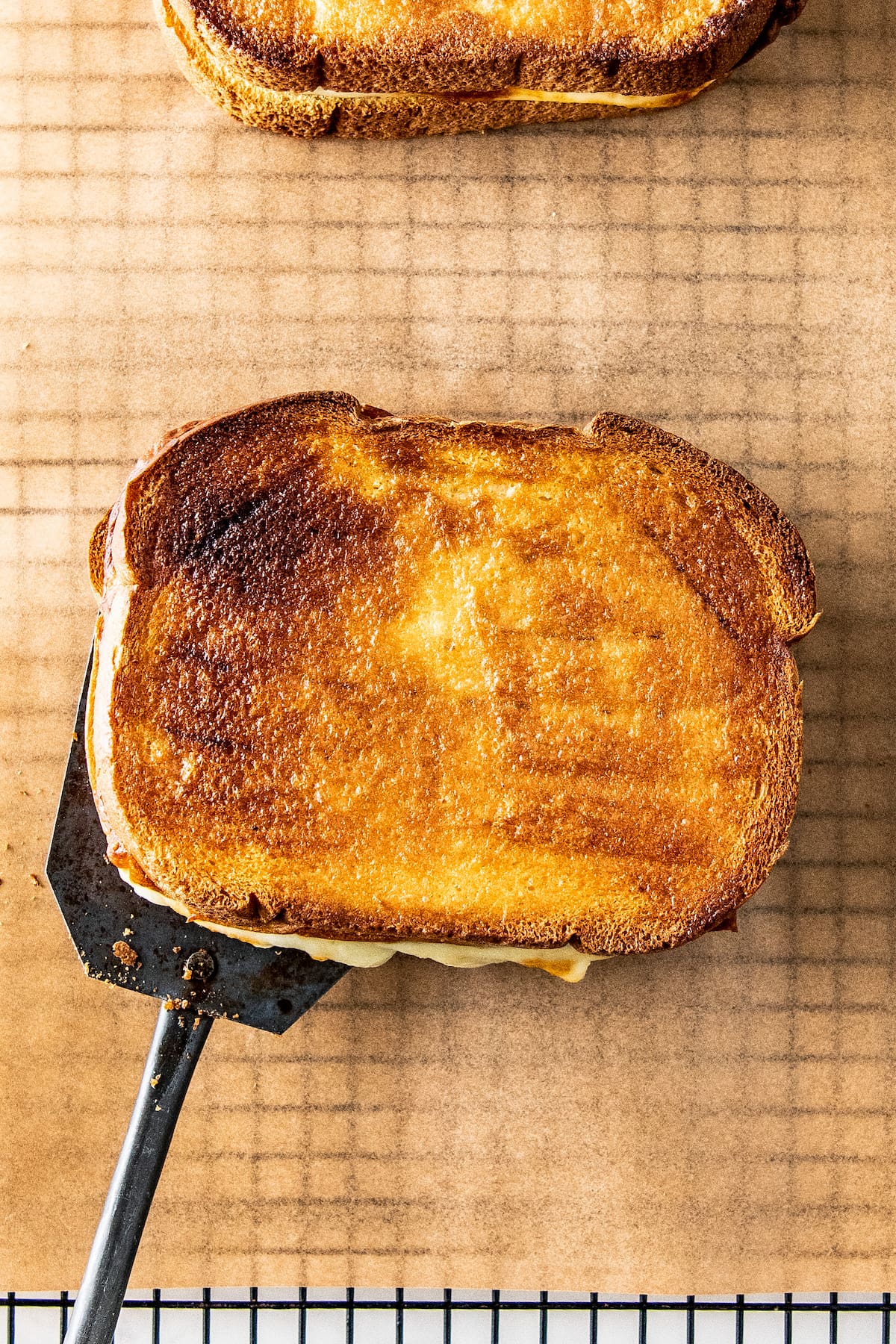 a grilled sandwich on a spatula