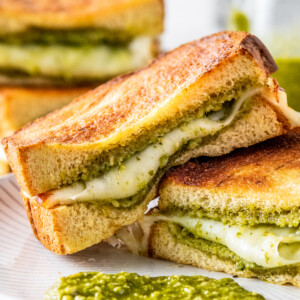 Open-faced grilled cheese sandwich with pesto