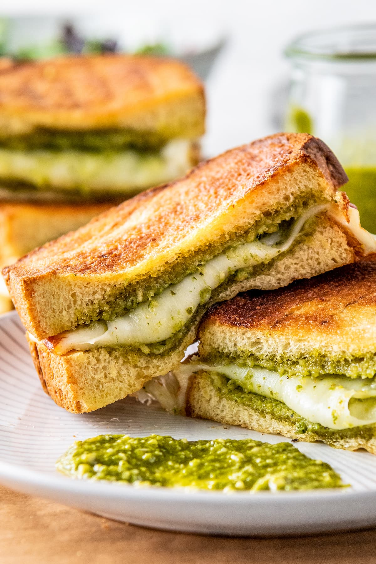 Open-faced grilled cheese sandwich with pesto