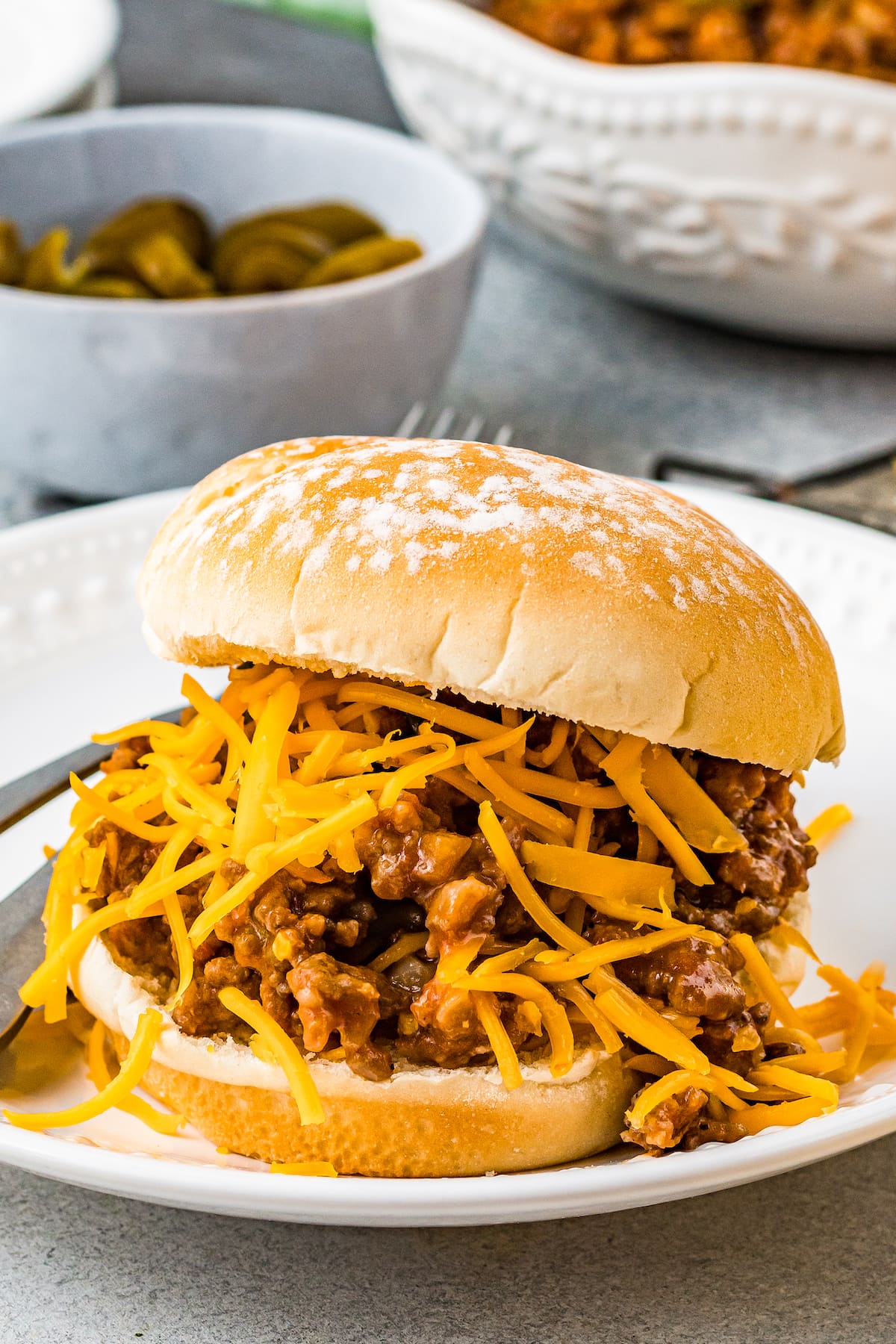 Sloppy Joe sandwich with beef, meat sauce, and shredded cheese