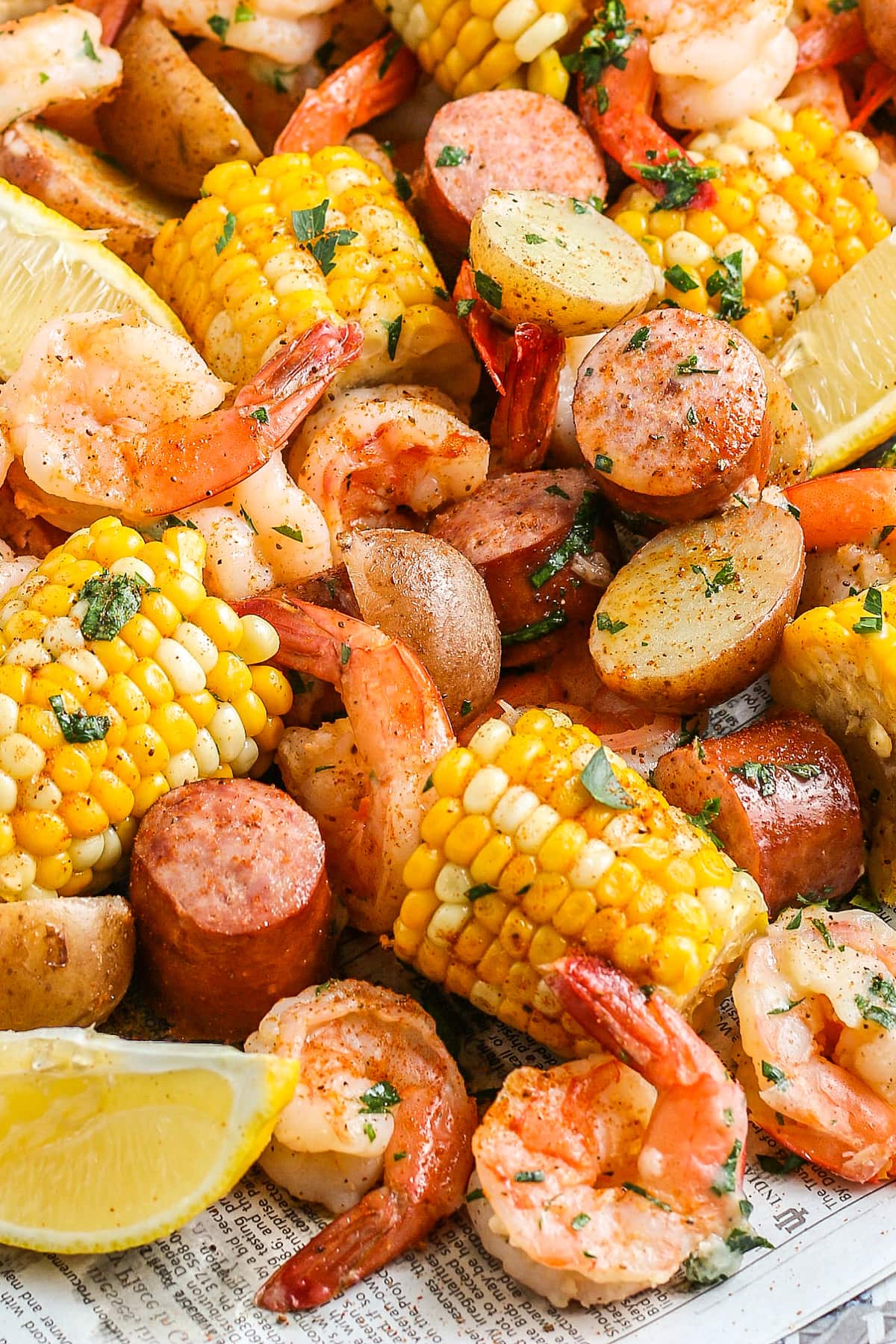 boiled shrimp with corn on the cob, sausage, and potatoes