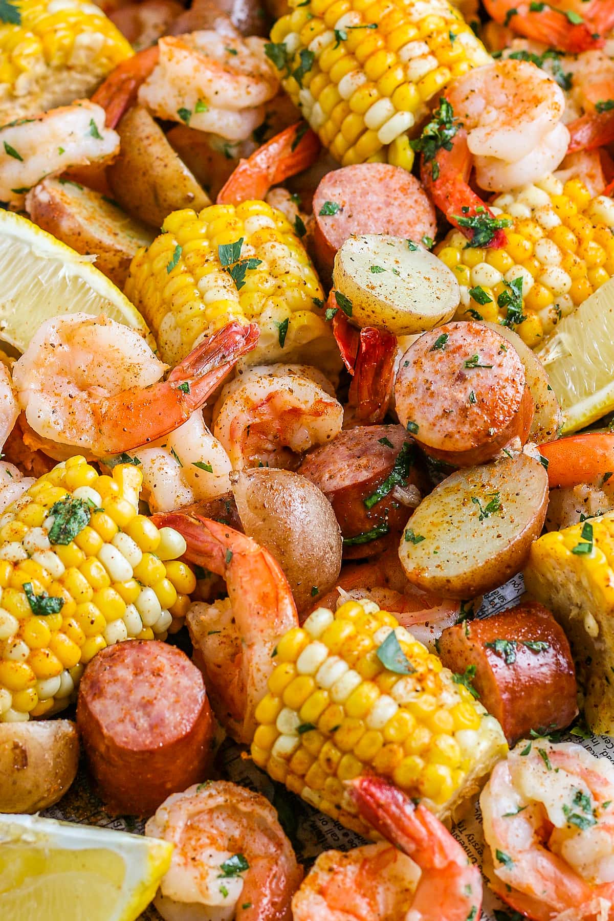 boiled shrimp with corn on the cob, sausage, and potatoes