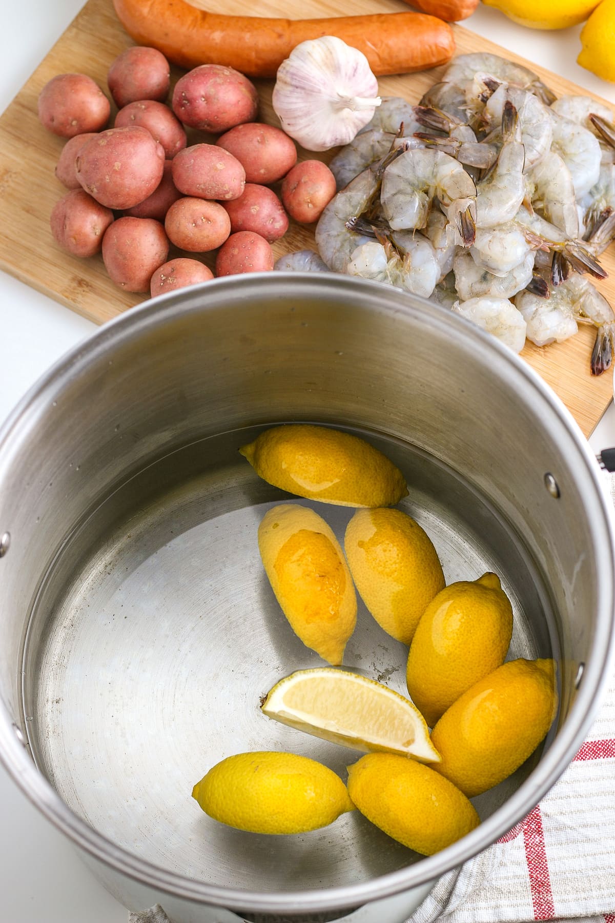 lemon wedges and water in a large pot