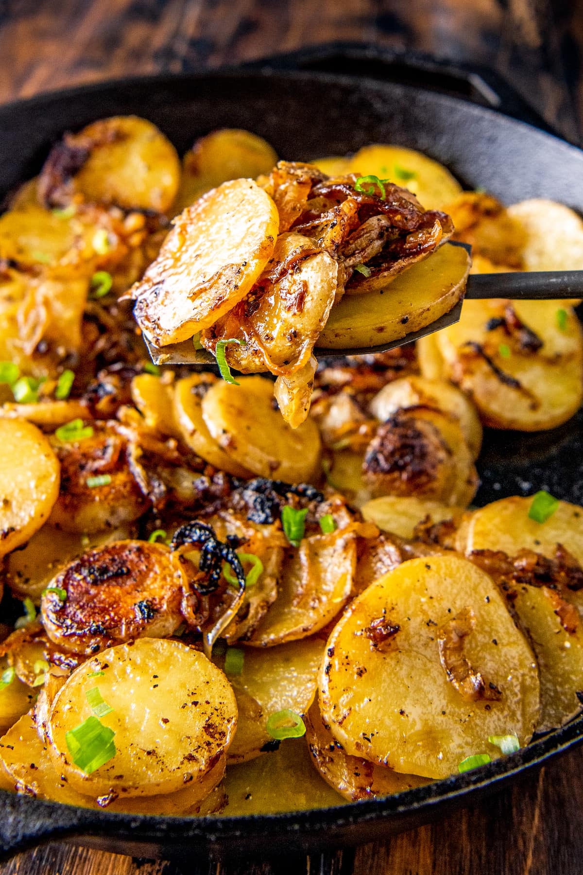 fried potatoes with onions in a skillet