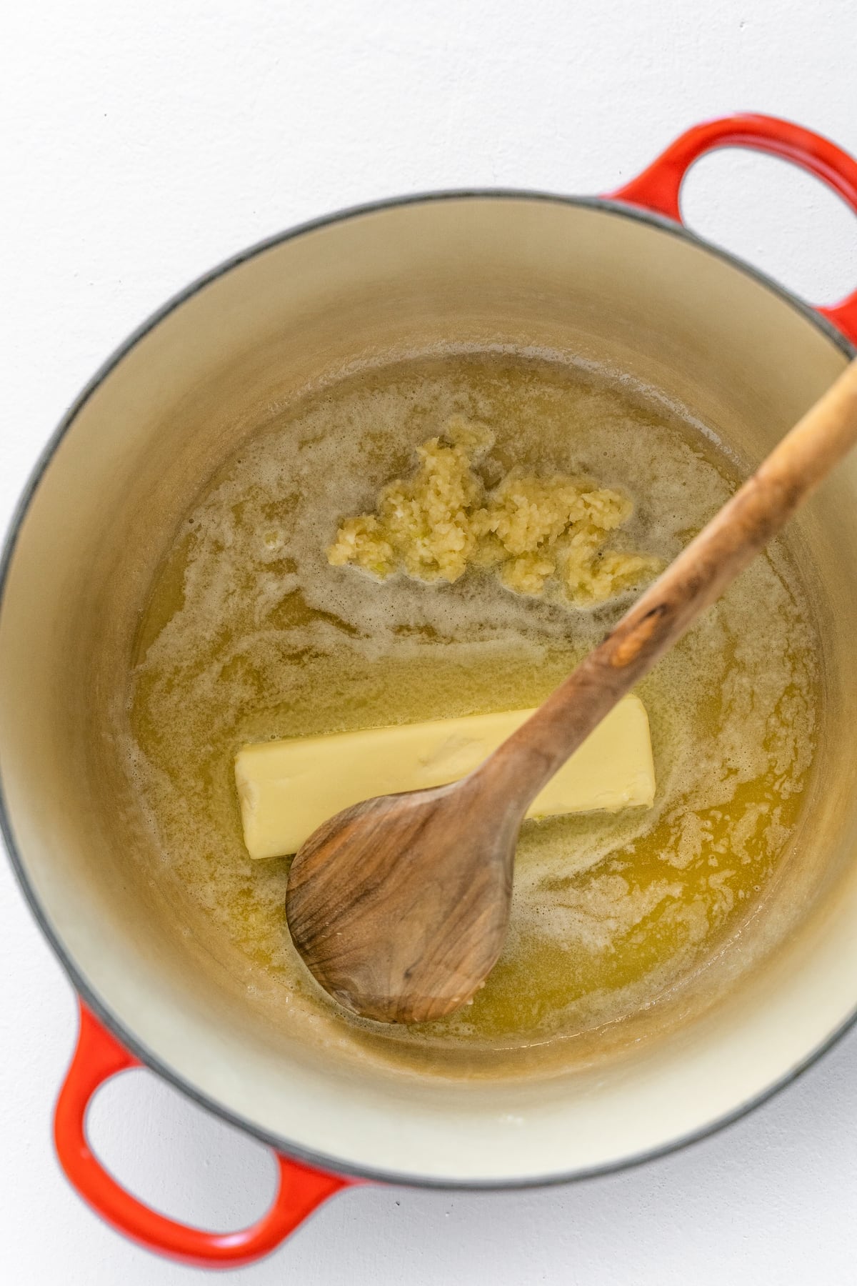melting a whole stick of butter with garlic