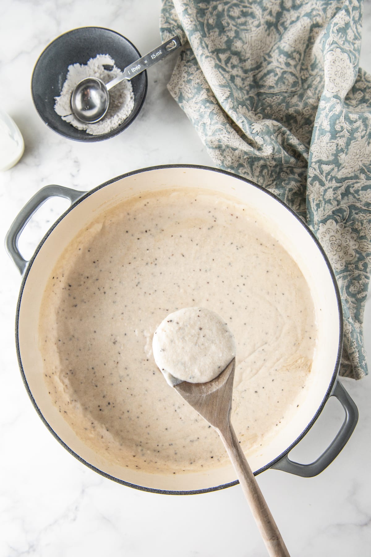 a pot with thick homemade white gravy