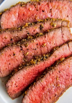 sliced medium-rare steak that's heavily seasoned