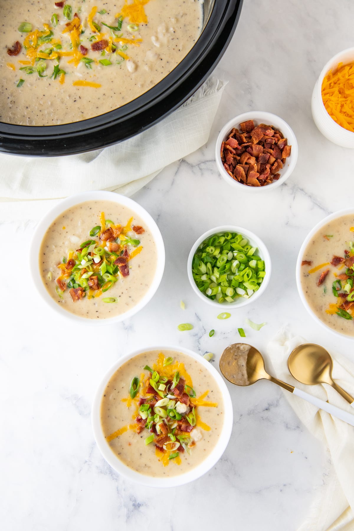 two bowls of baked potato soup