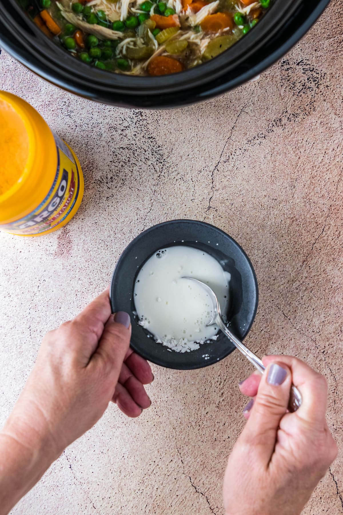 making a cornstarch slurry in a small bowl