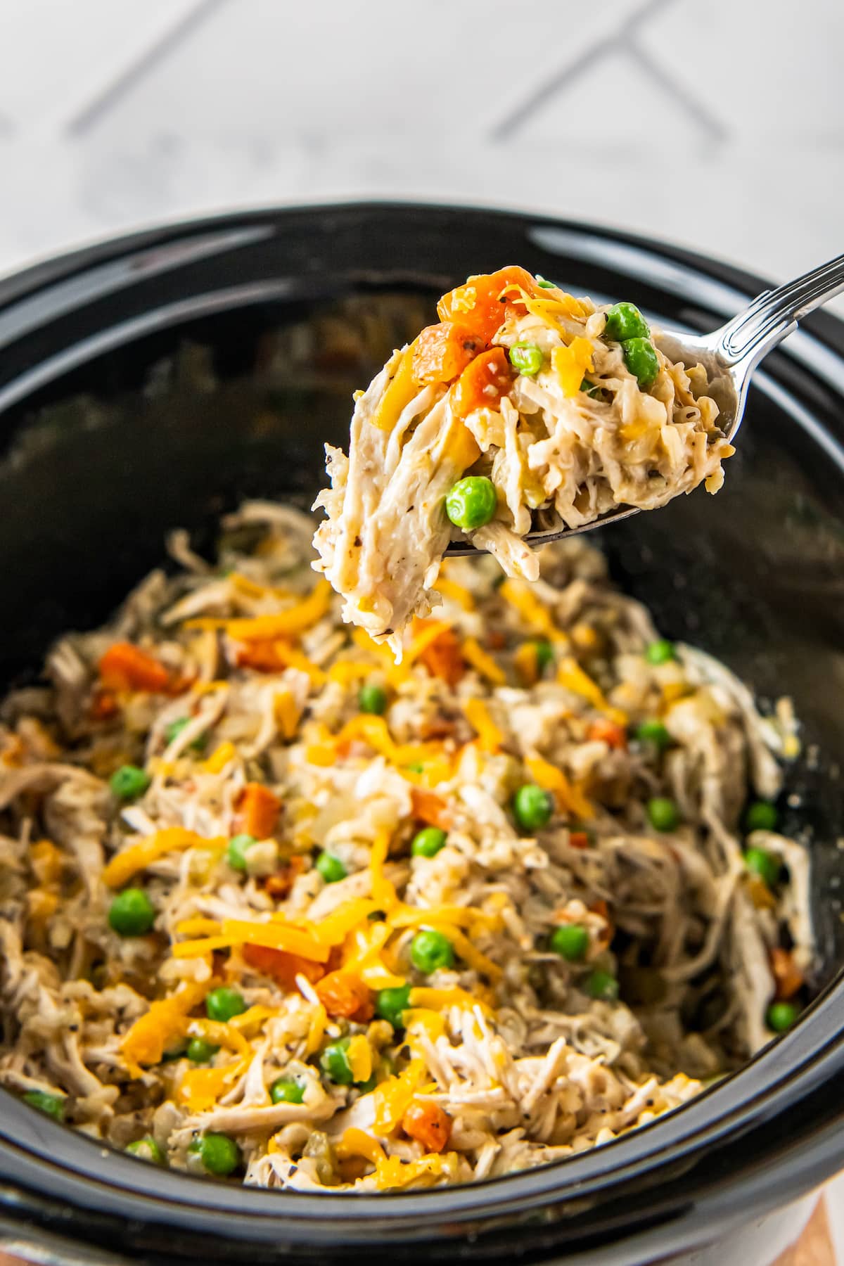 crockpot chicken and rice with shreeded cheese and vegetables