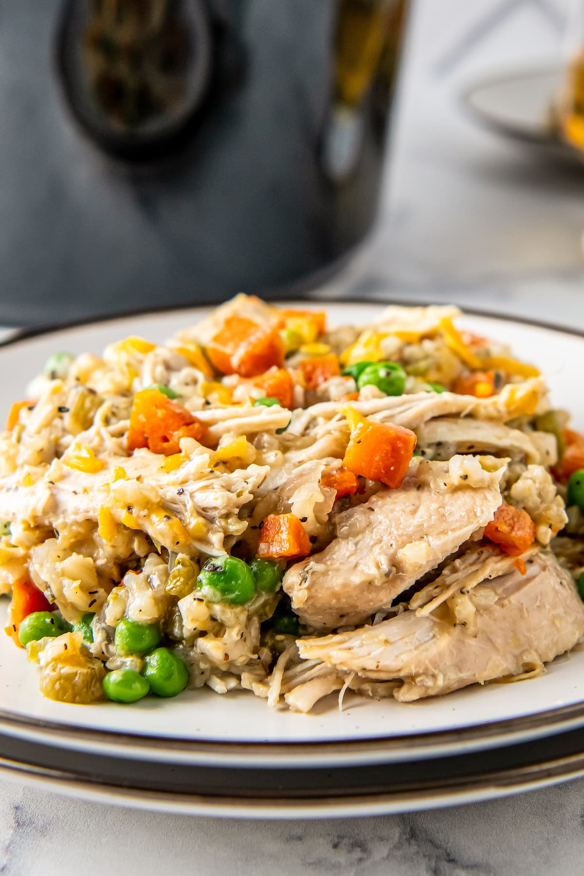 plate with chicken, rice, and vegetables
