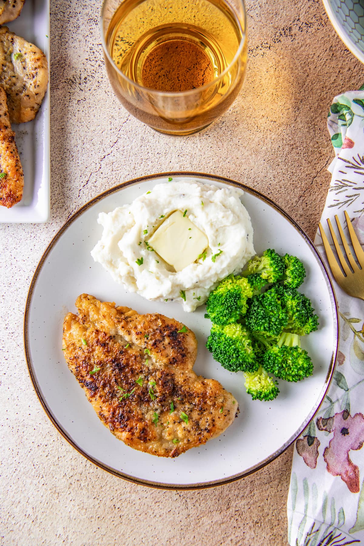 pan seared chicken breast, mashed potatoes, and broccoli