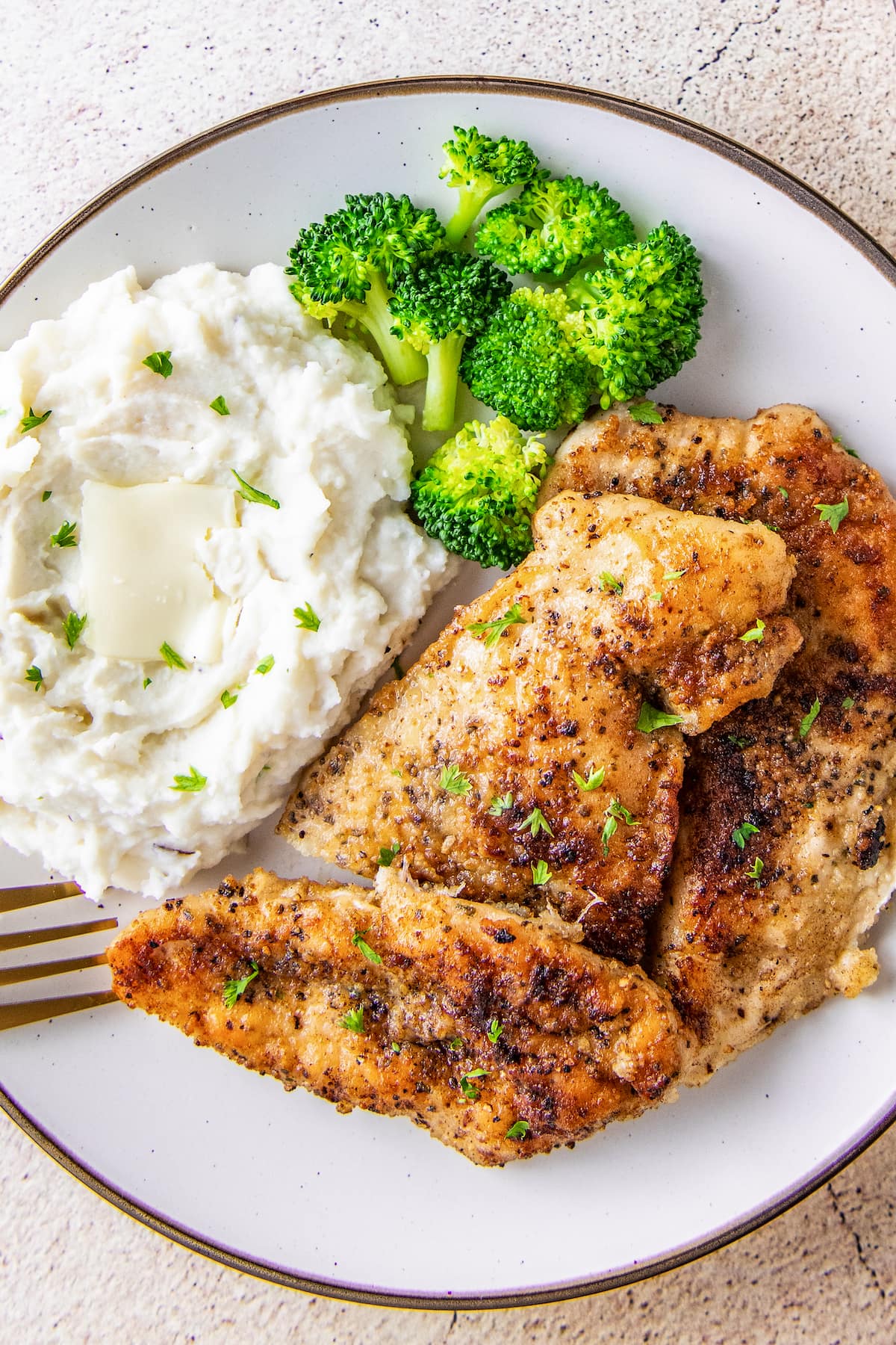 pan seared chicken breast, mashed potatoes, and broccoli