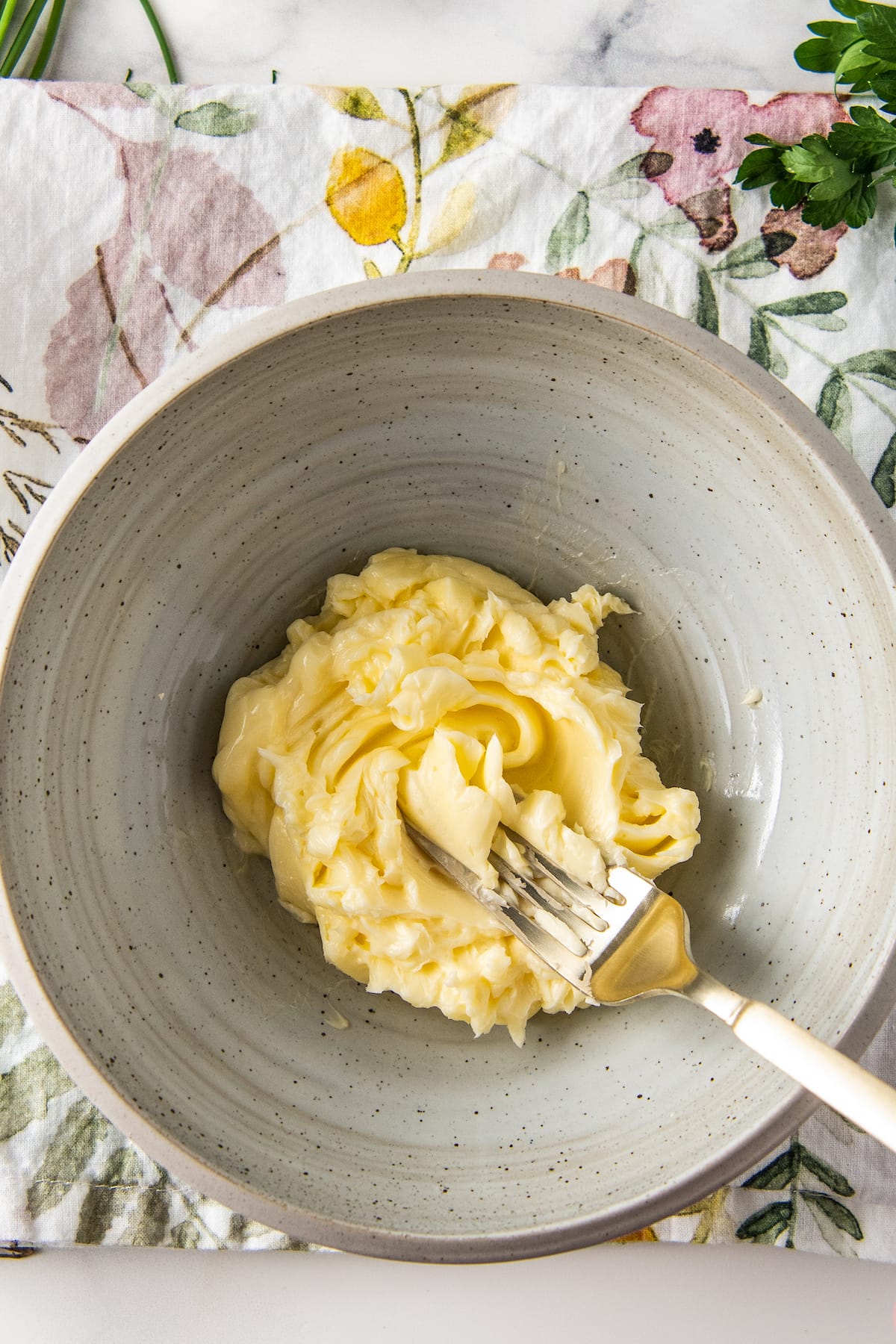 whipped butter in a bowl with a fork