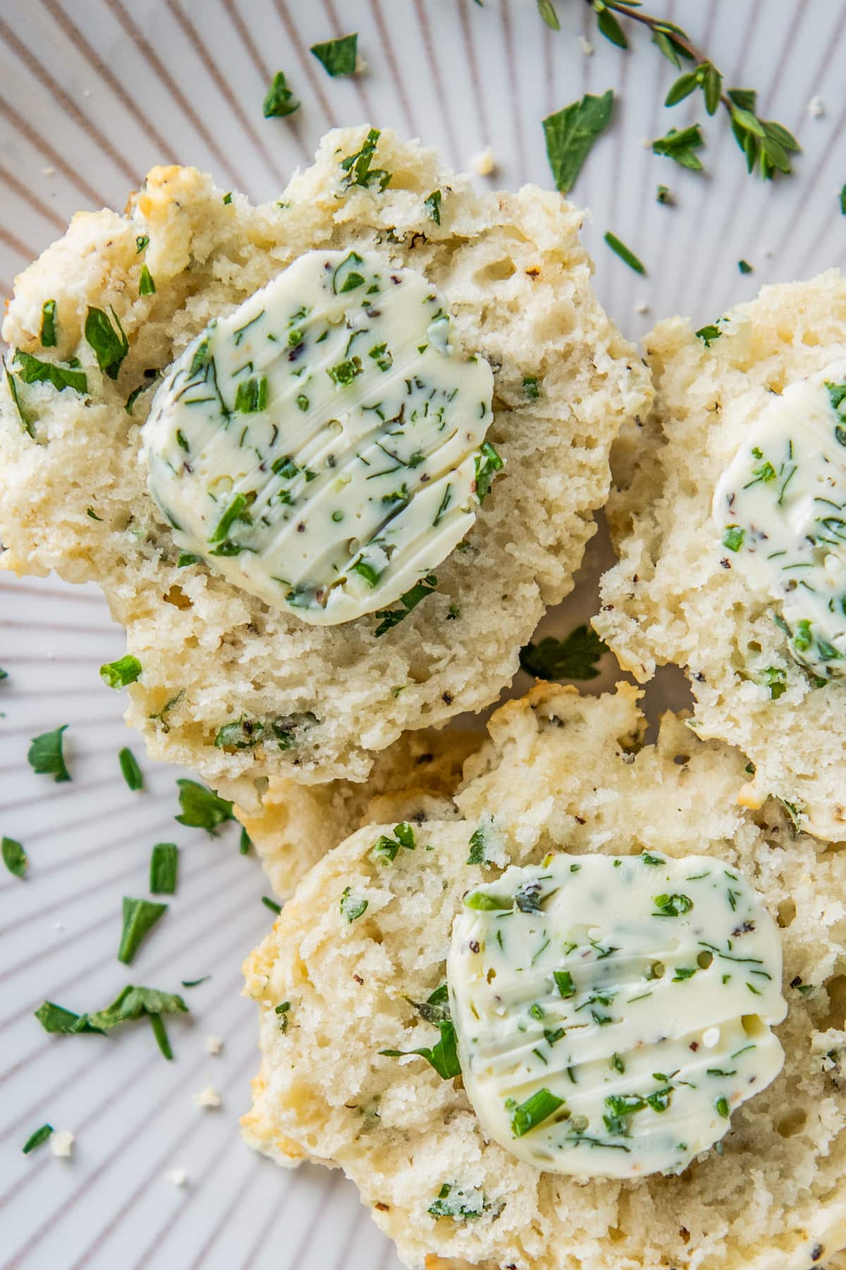 herb biscuits with herb butter on them