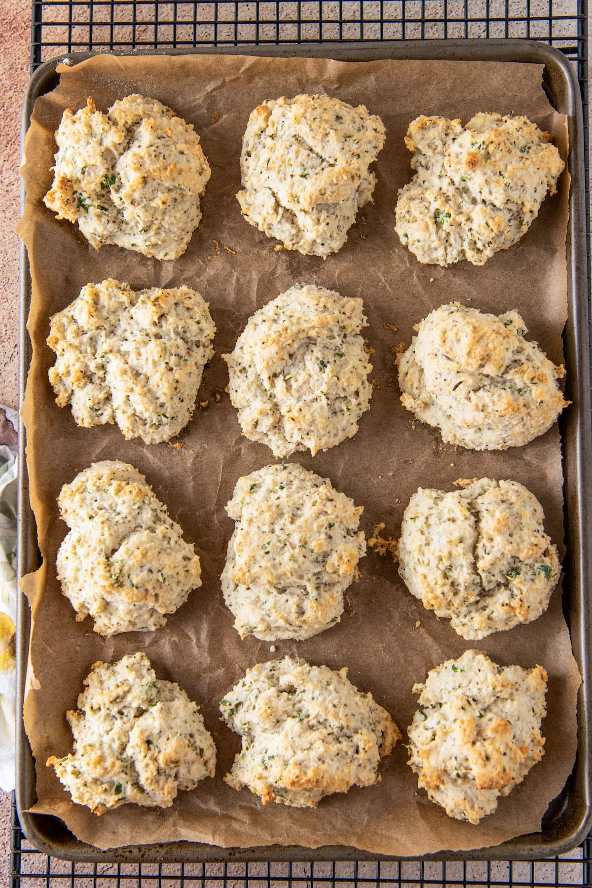 herb drop biscuits on a sheet tray