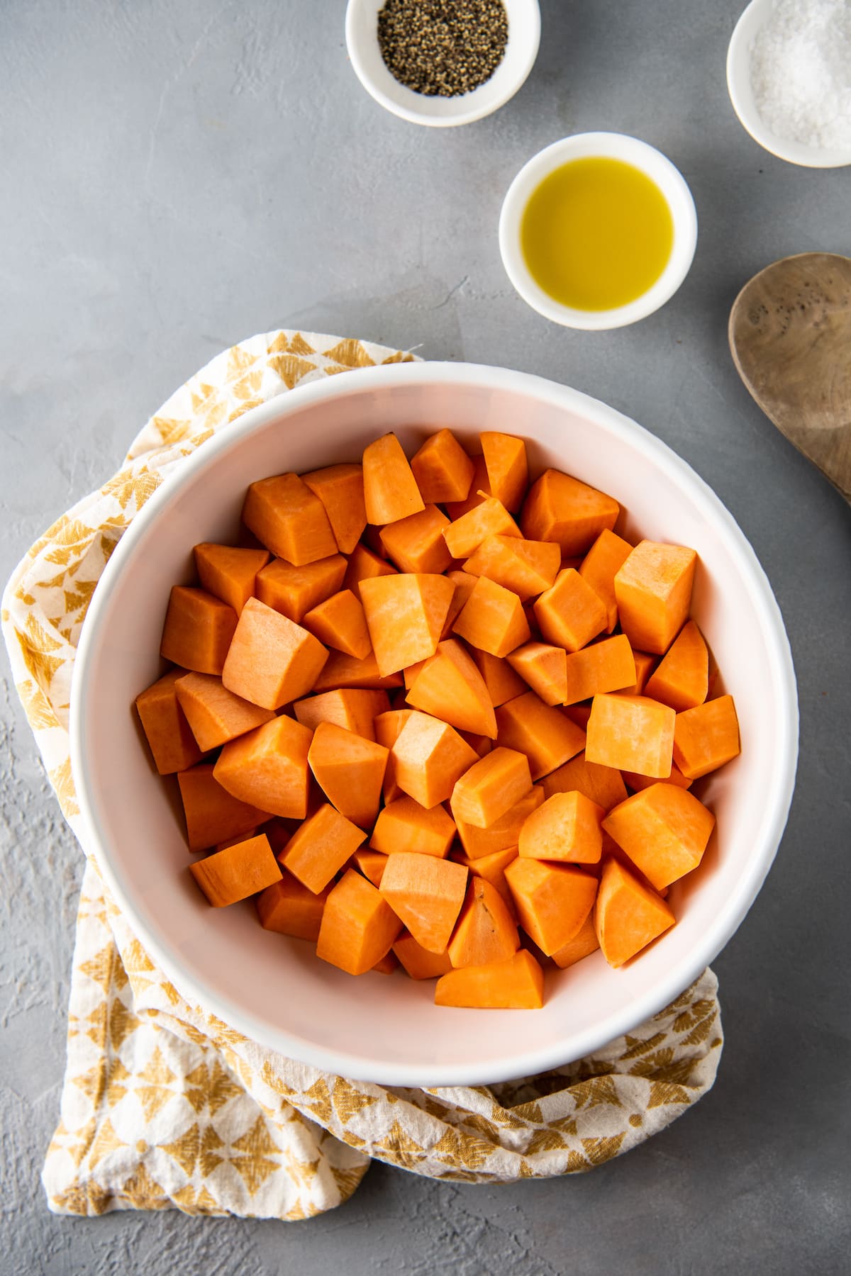 a bowl of cut up sweet potatoes