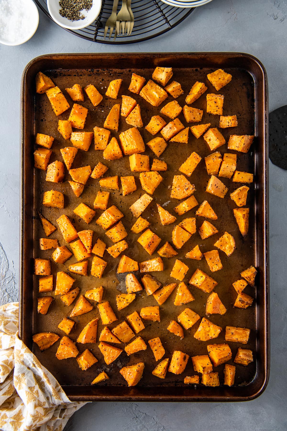 roasted sweet potatoes on a sheet tray