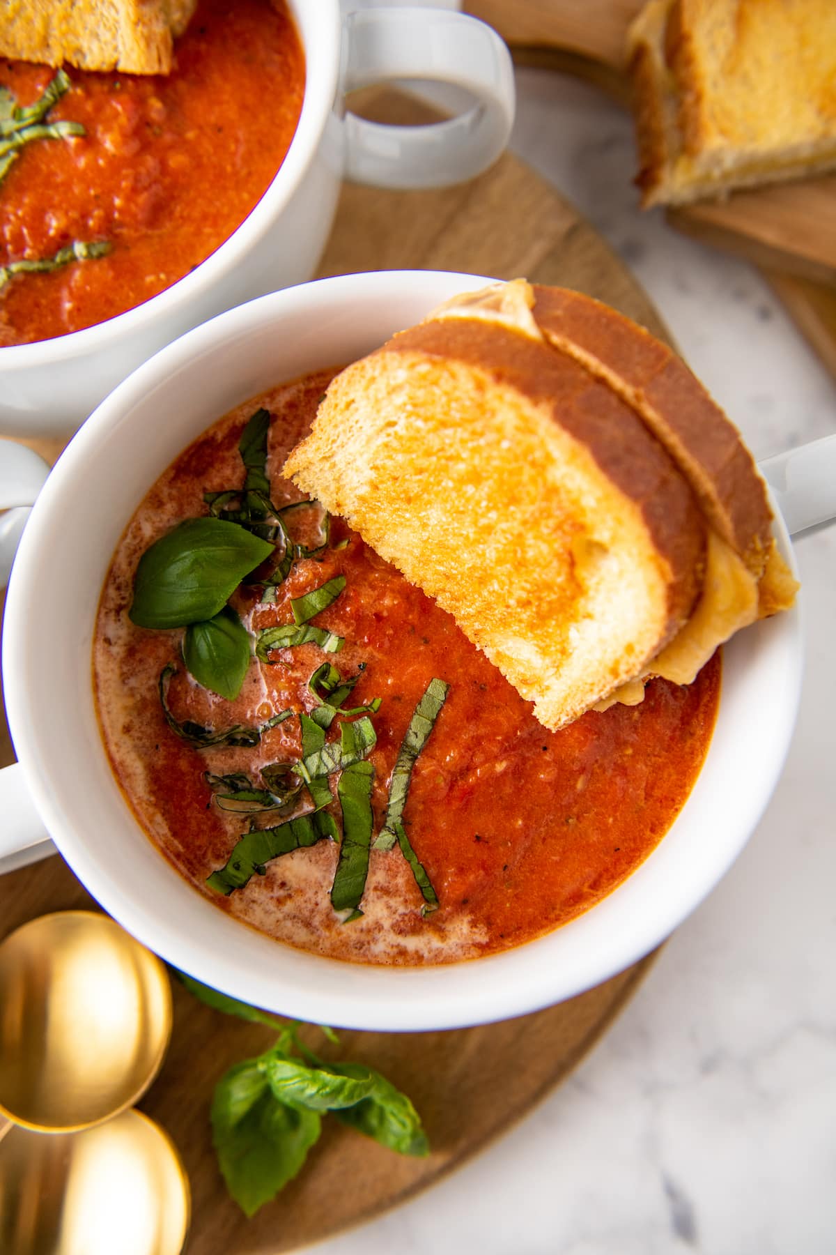 tomato basil soup with grilled cheese in the bowl