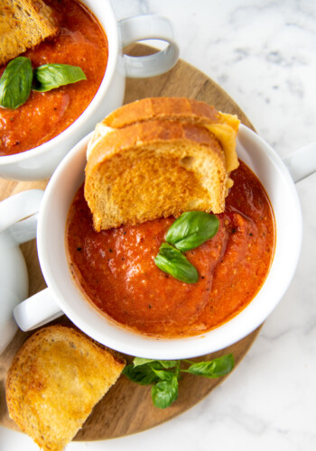 tomato basil soup with grilled cheese in the bowl