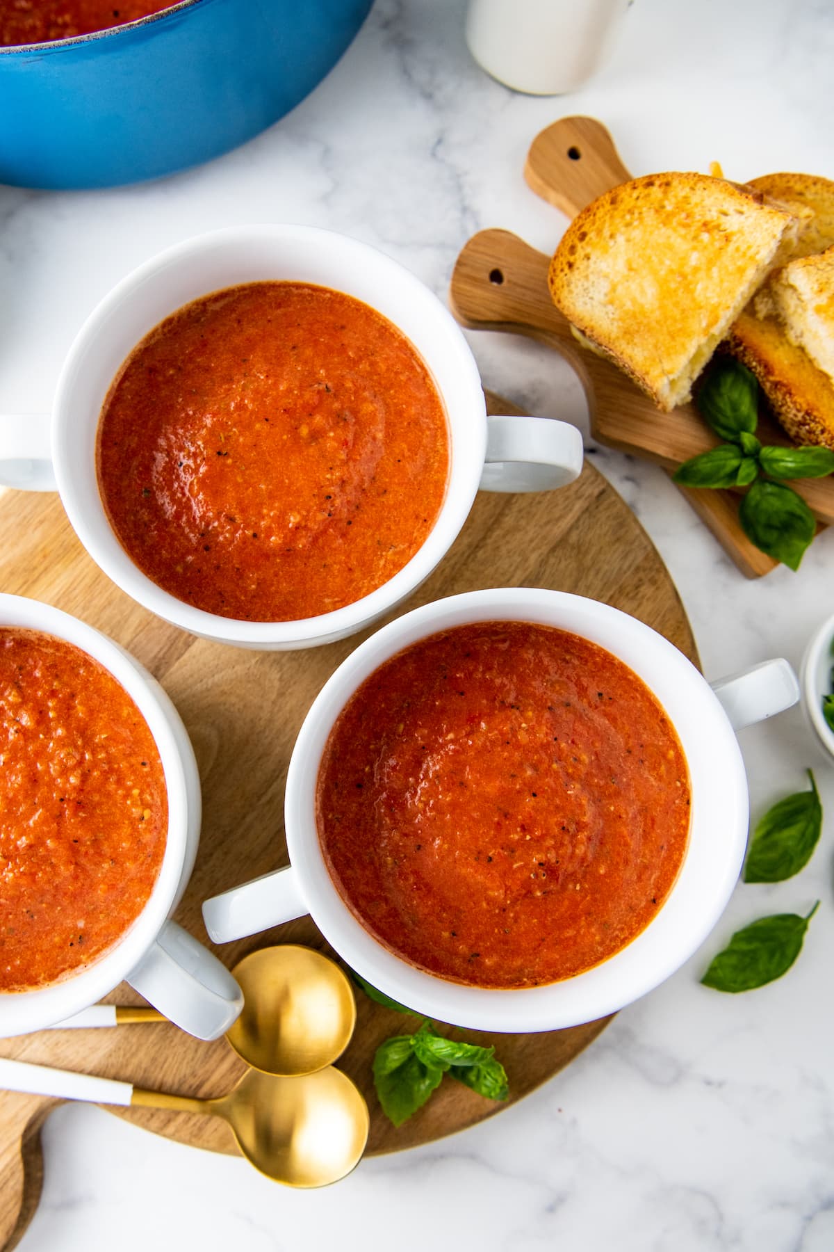 three mugs of tomato soup