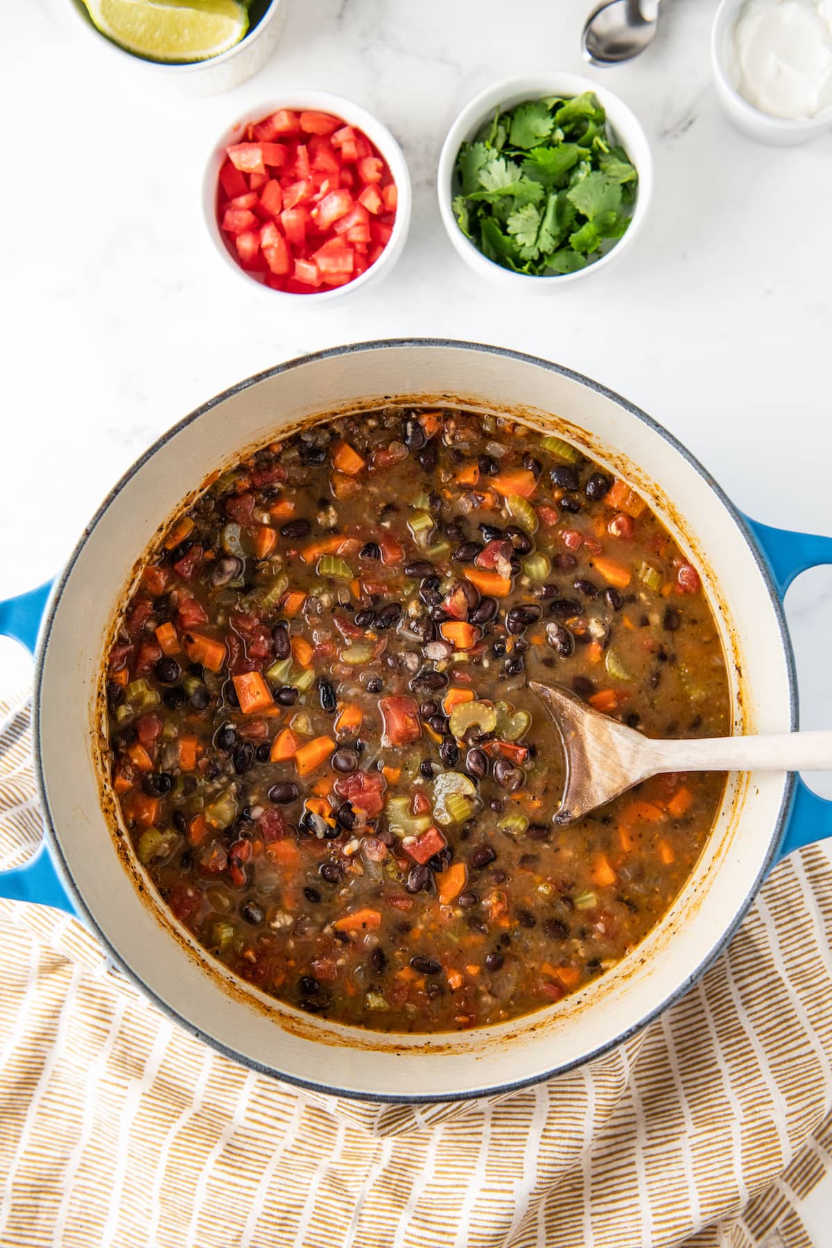 a large pot with carrot and black bean soup