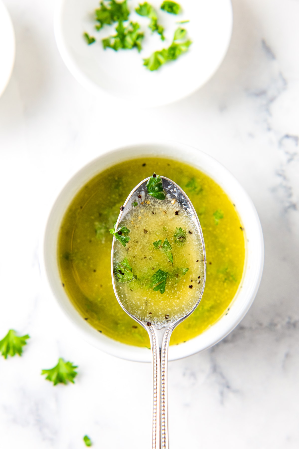 melted butter with seasonings and herbs
