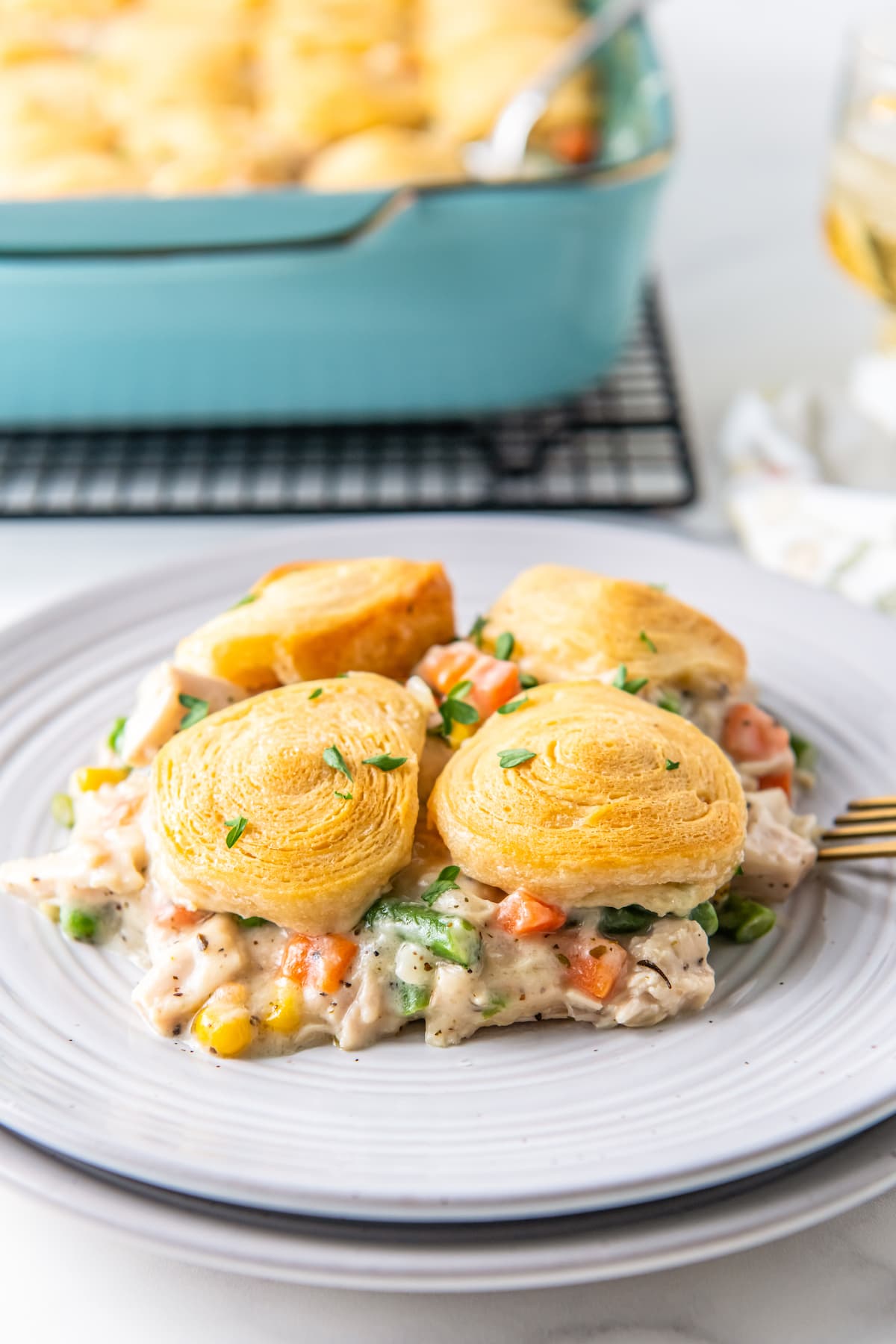 a plate of chicken pot pie casserole with biscuit topping