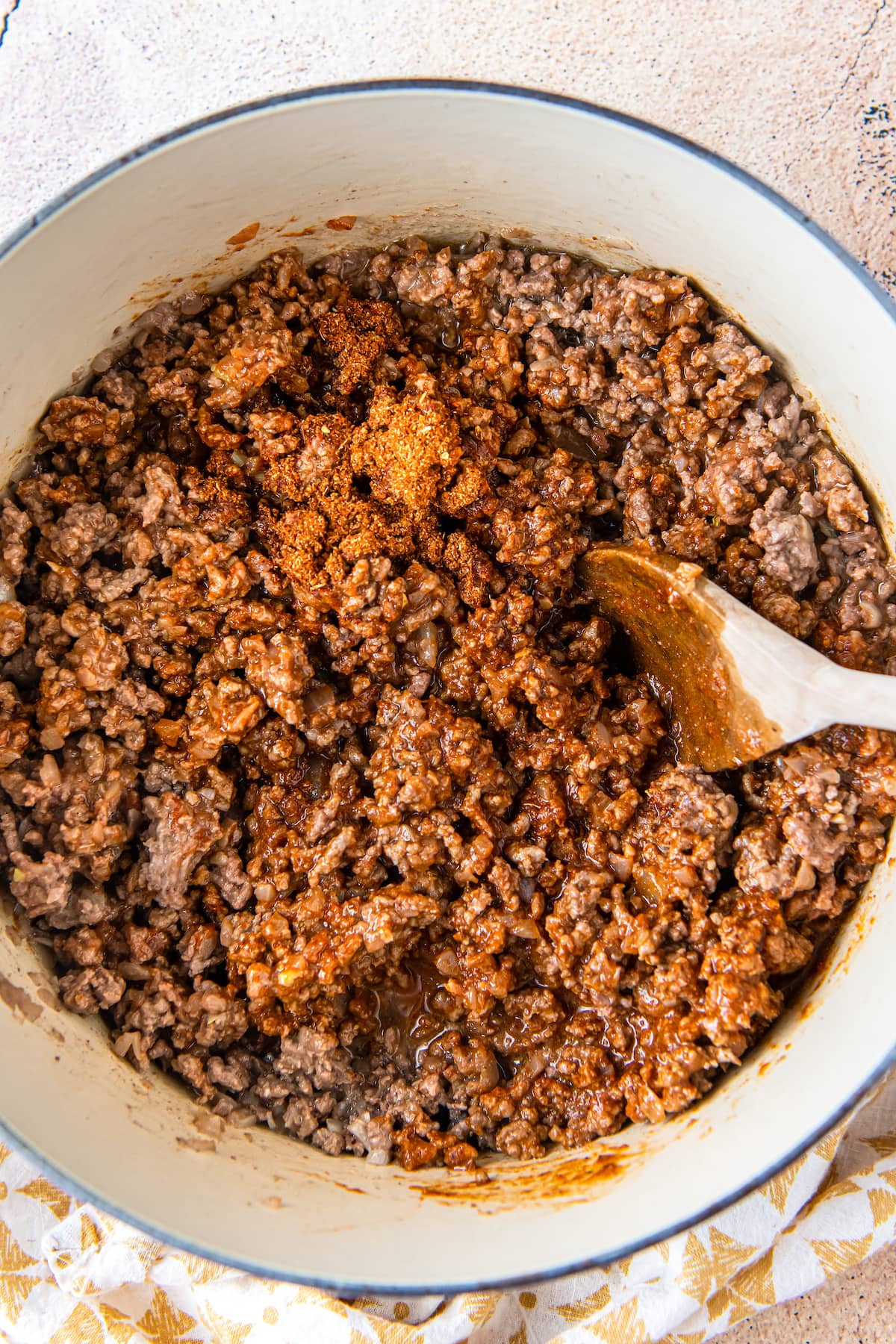 Seasoned ground beef in a pot. 