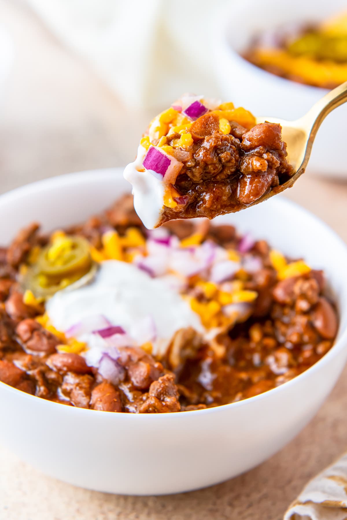 taking a spoonful out of a bowl of chili