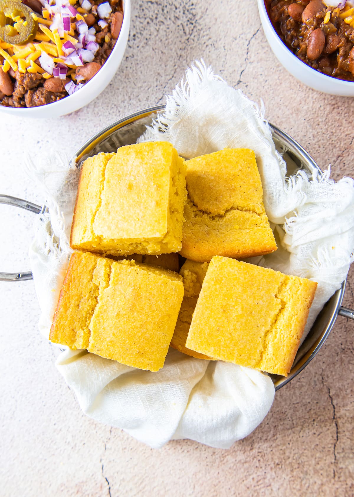 cut up pieces of cornbread in a bowl