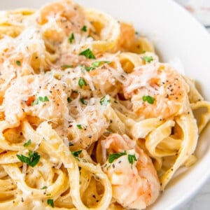 close up of shrimp alfredo on a plate
