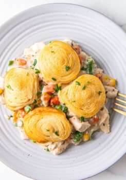 a plate of chicken pot pie casserole with biscuit topping