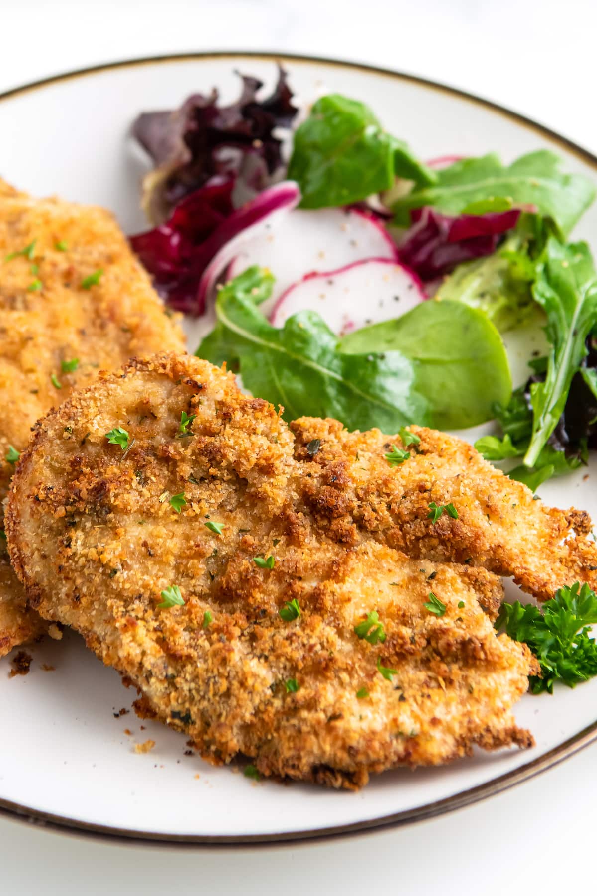 chicken cutlets with green salad on the side