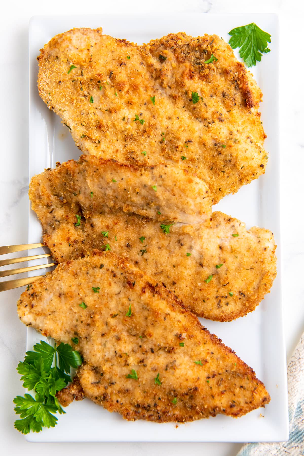 a platter of crispy chicken cutlets