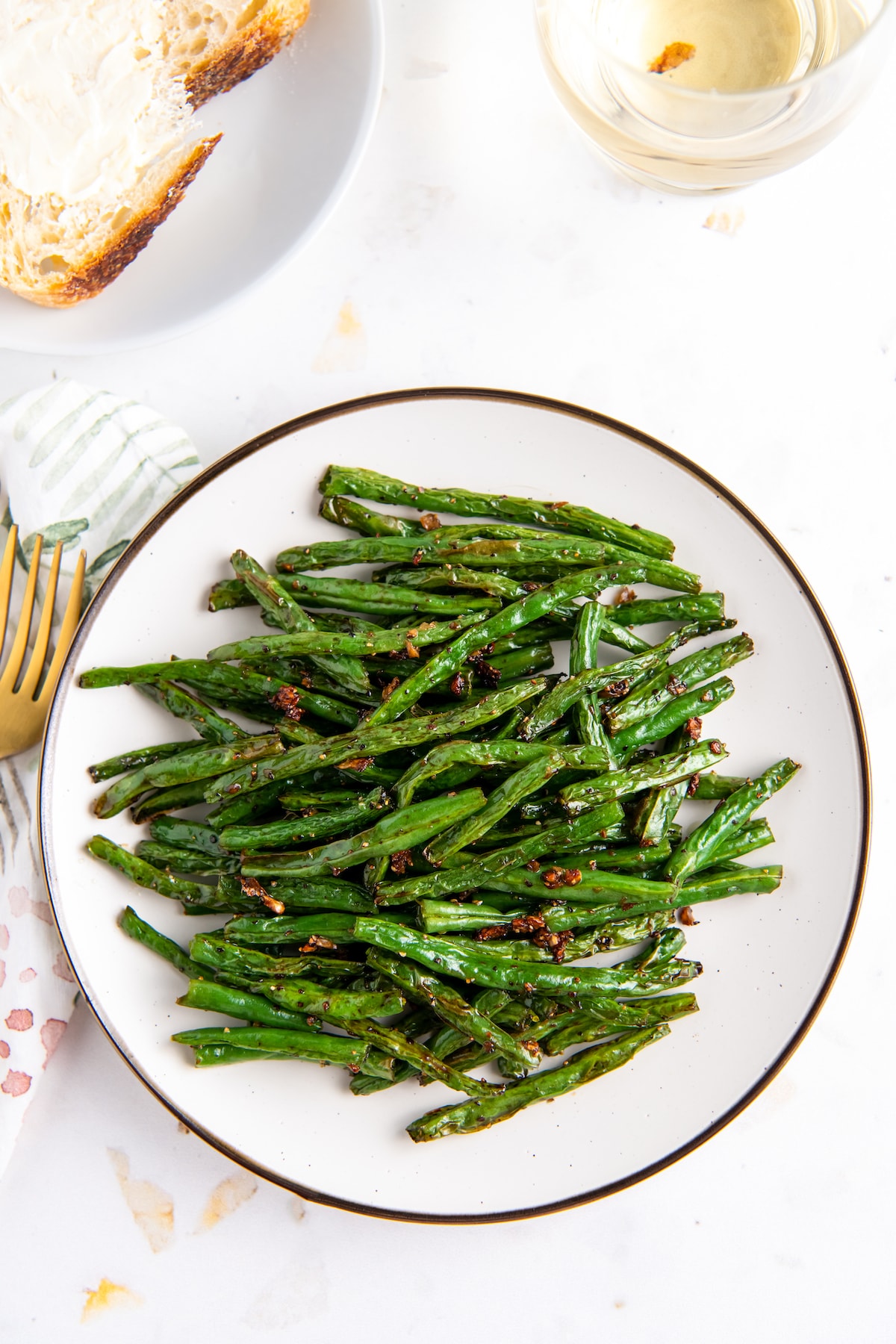 a plate of cooked and seasoned green beans