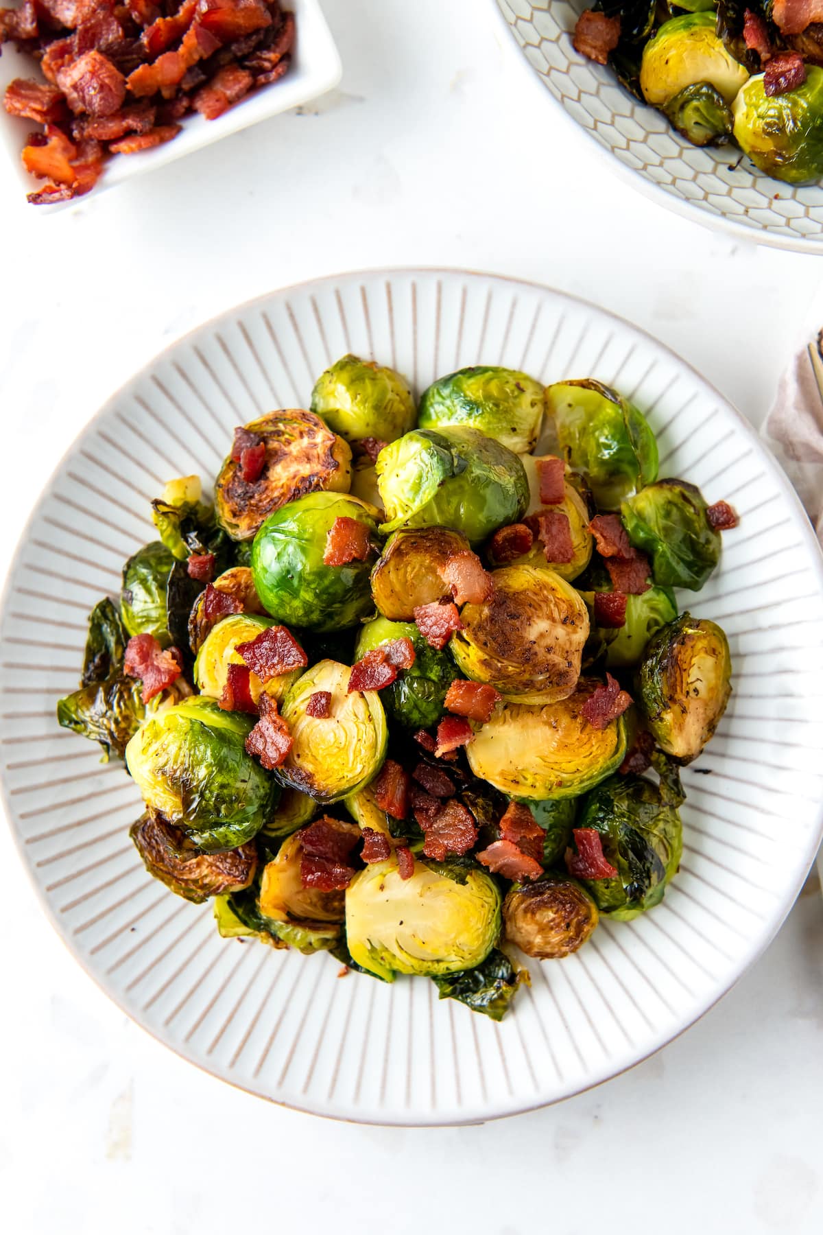 a plate of roasted brussels sprouts with bacon