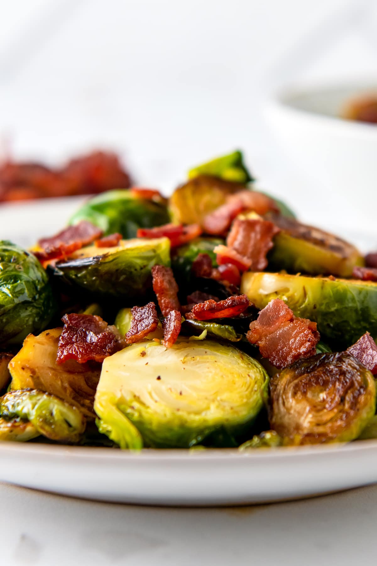 close up of roasted brussels sprouts and bacon pieces