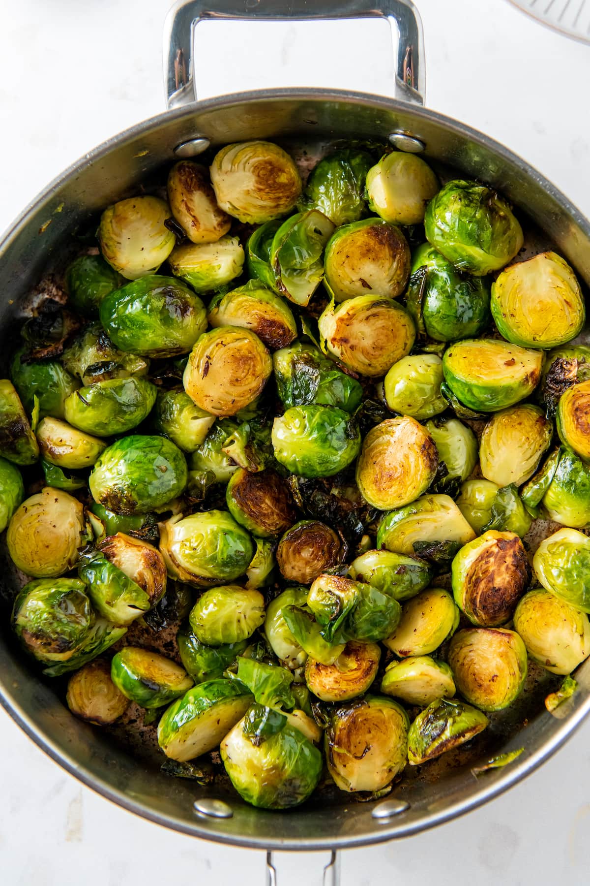 a pan of brussels sprouts and bites of bacon