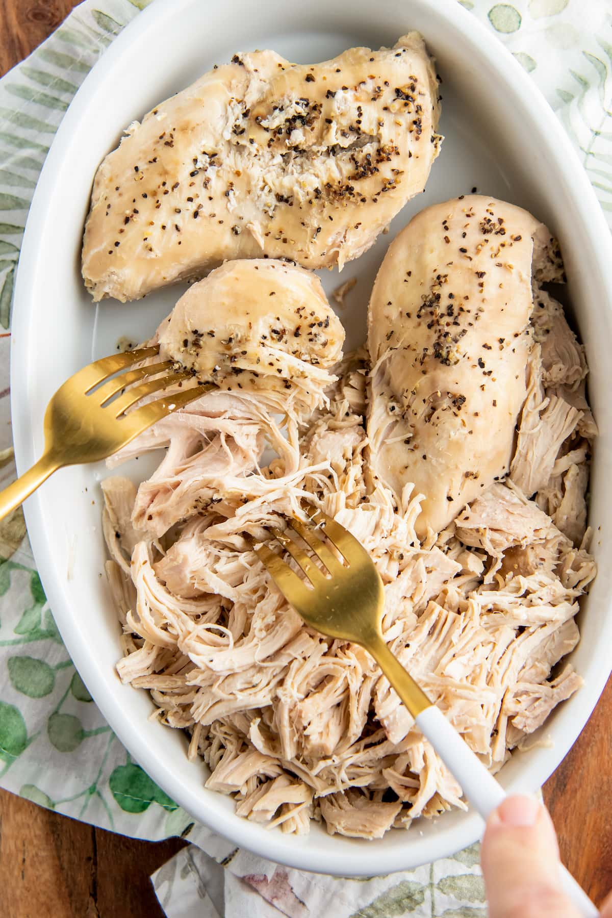 shredding chicken breasts with a fork