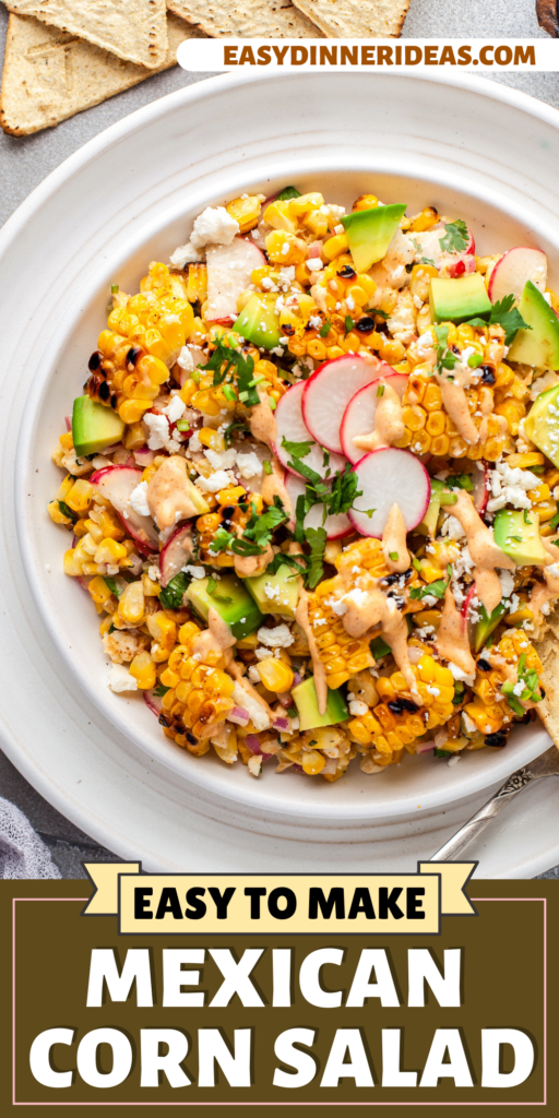 Mexican corn salad in a bowl with a spoon.
