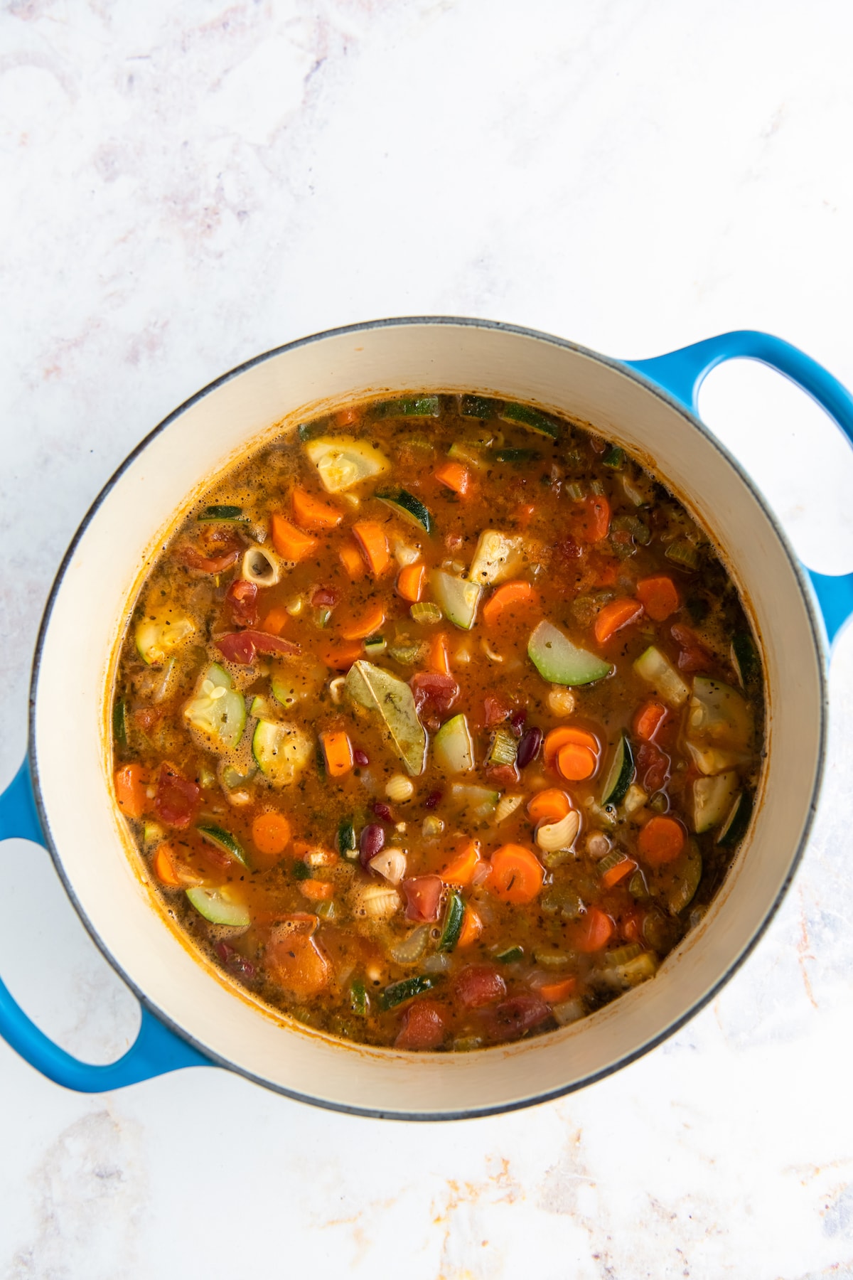 a vegetable filled soup in a large dutch oven