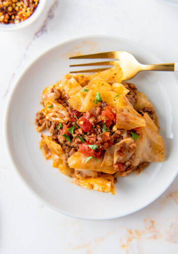 a plate of unstuffed cabbage rolls made with cabbage, beef, and tomatoes