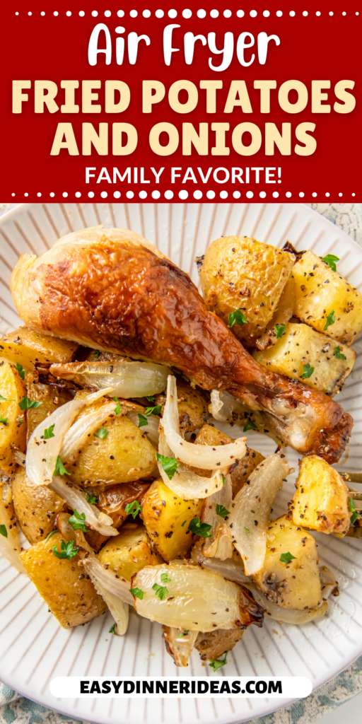 Chicken leg on a plate with potatoes and onions.