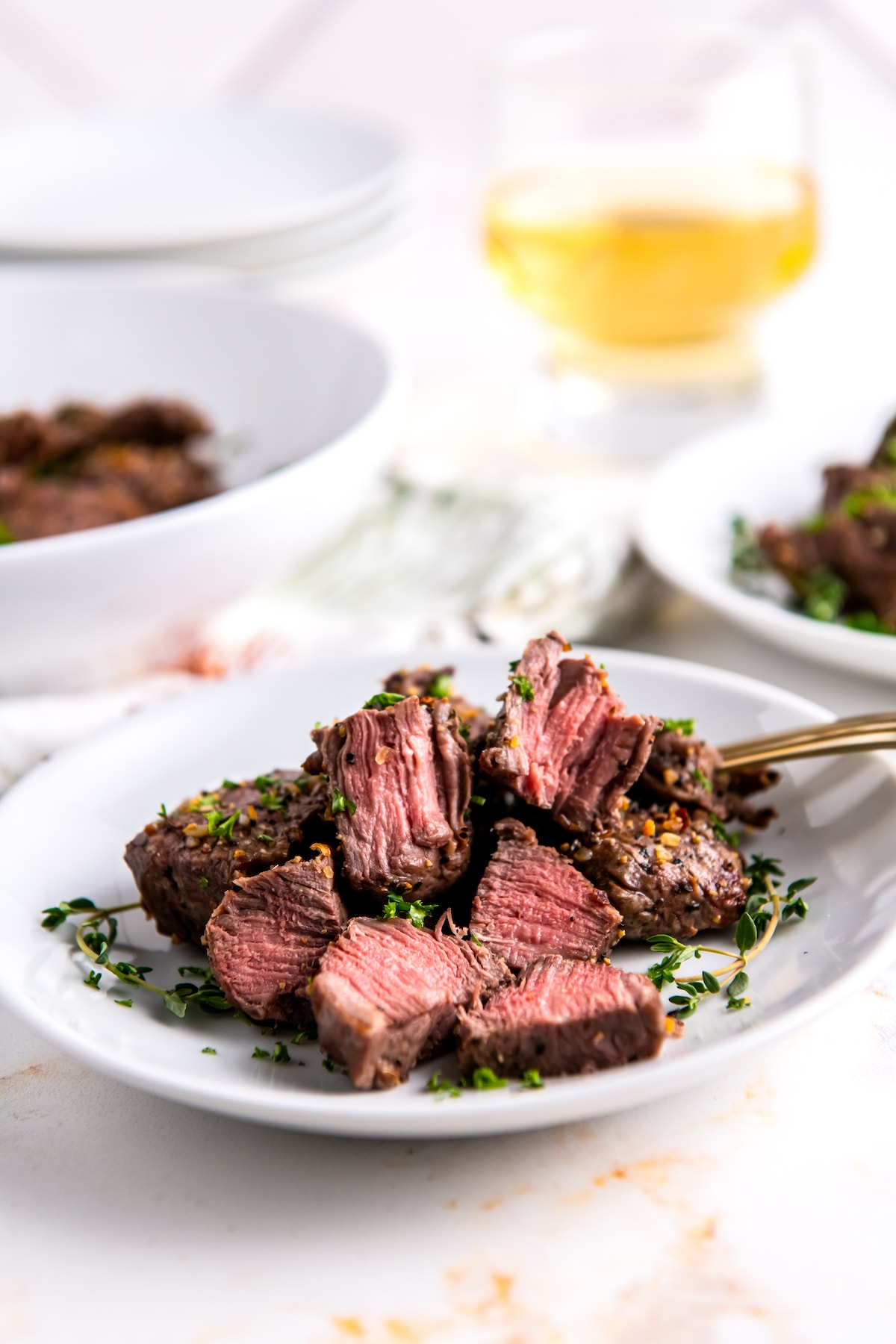 seasoned air fryer steak bites that have been cut in half and are cooked medium