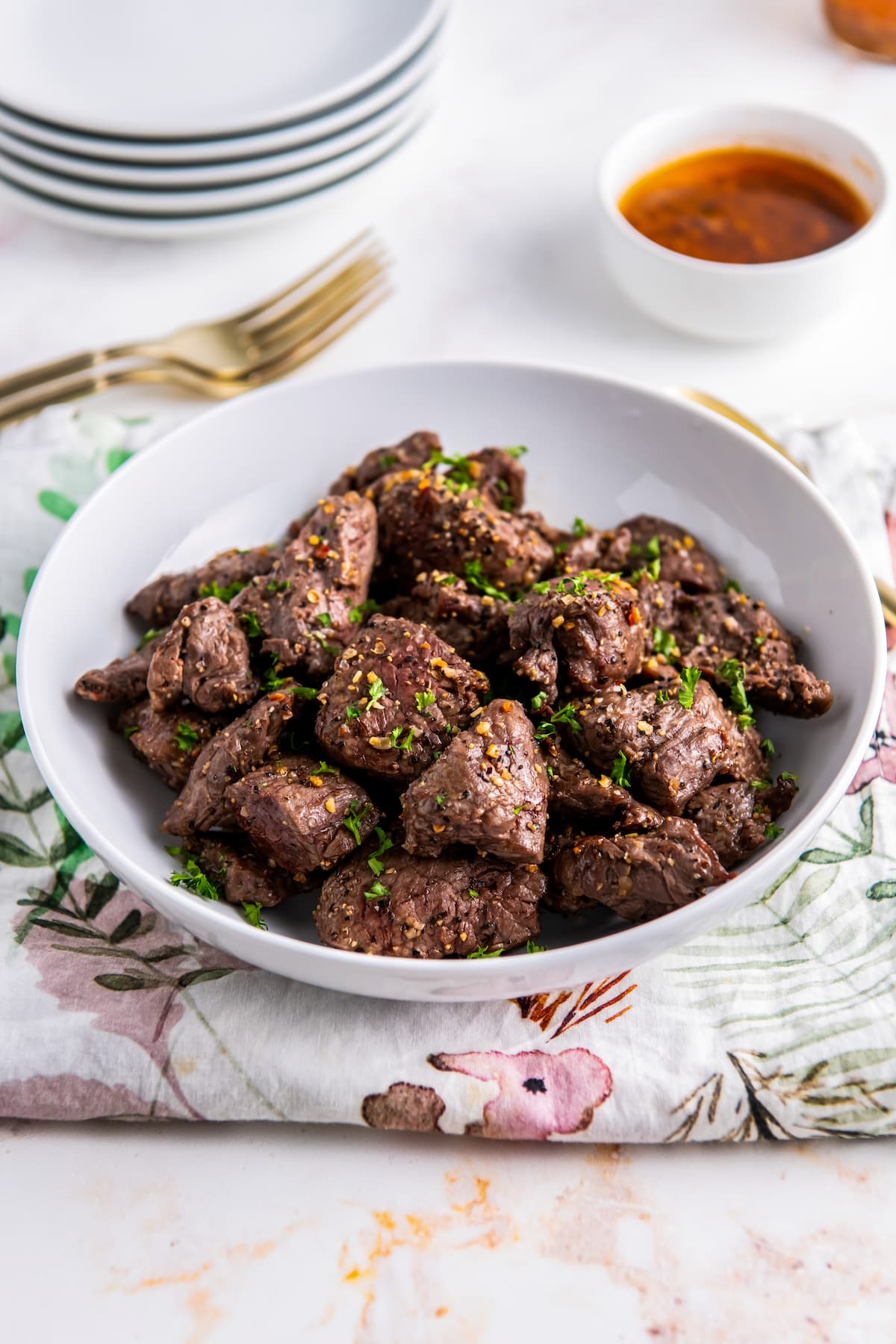 a bowl of cooked small bites of steak