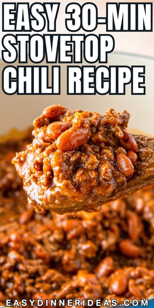 A wooden spoon lifting a portion of stovetop chili from the pot.