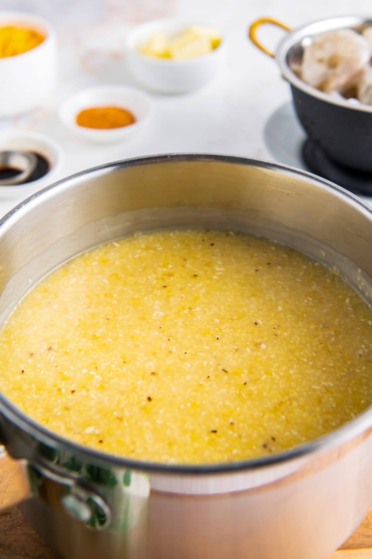 grits cooking in a sauce pot
