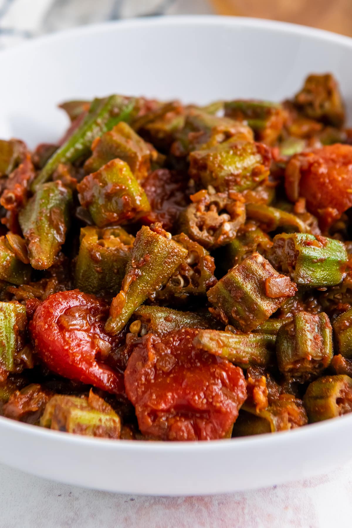 a bowl of stewed tomatoes and okra