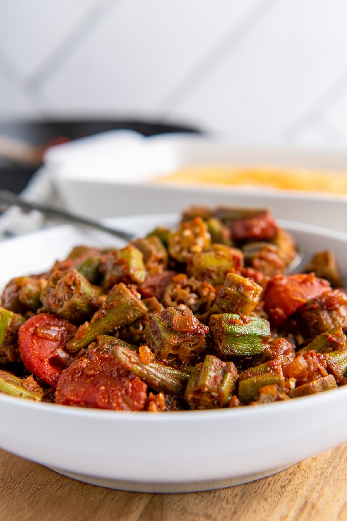 a bowl of stewed okra and tomatoes